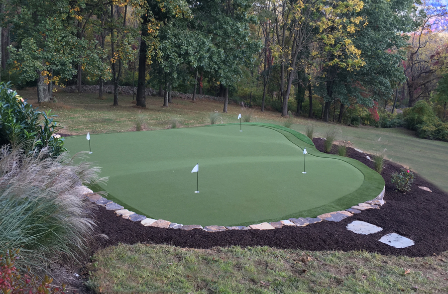 Landscaped personal artificial turf putting green in New Jersey