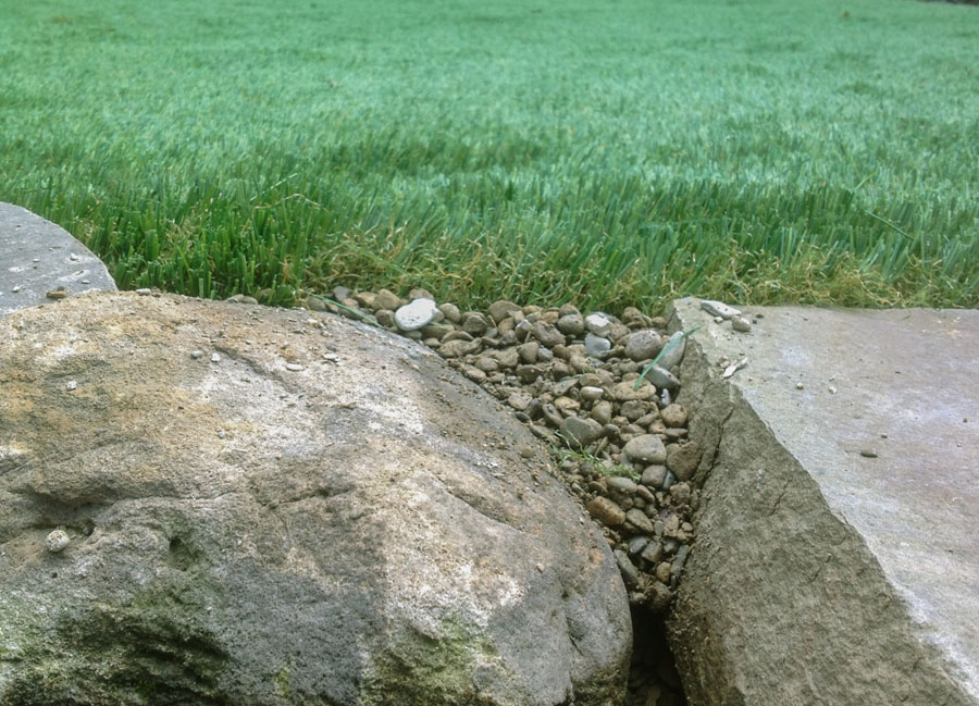 Close up of the edge of an artificial grass lawn